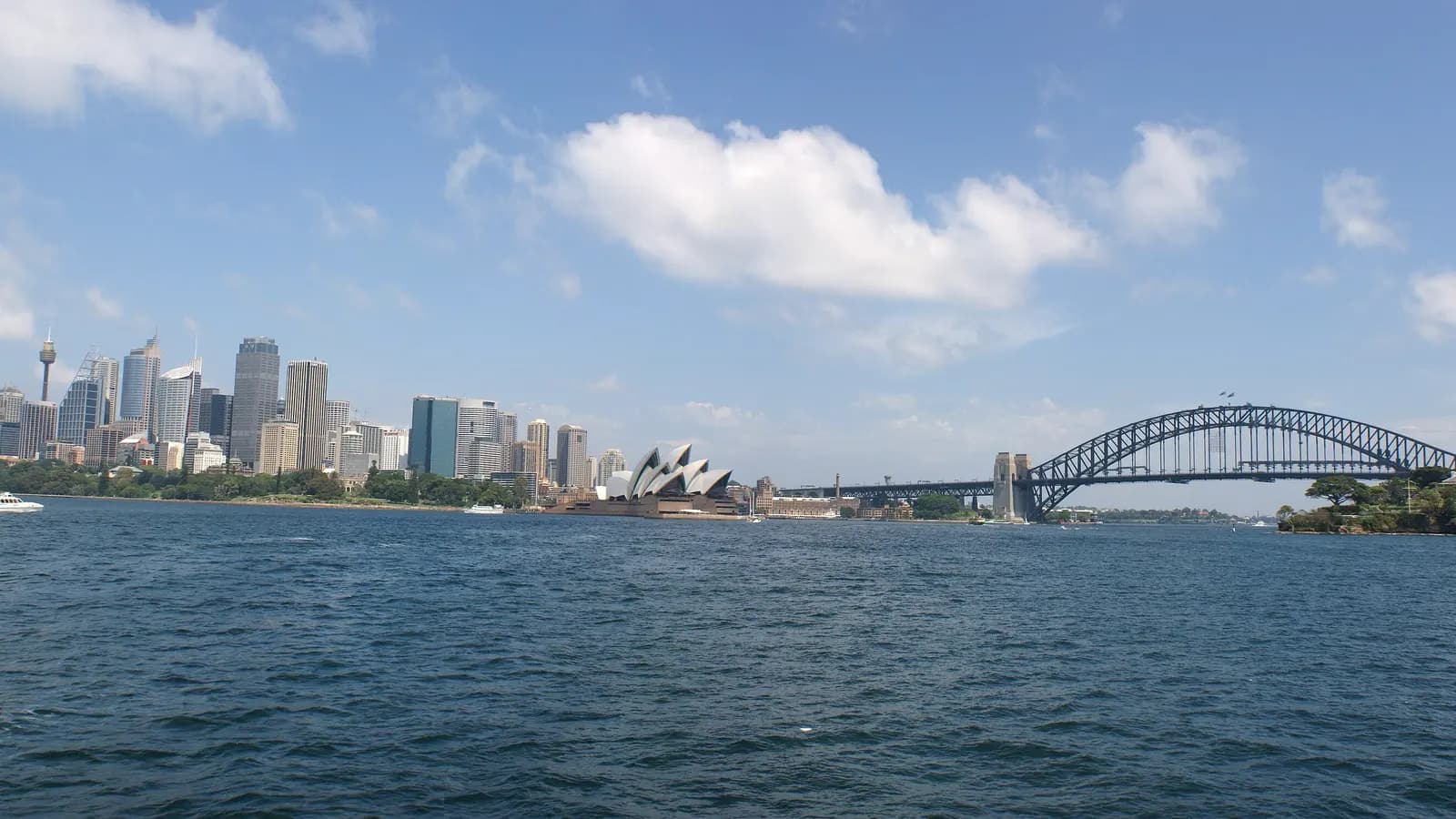 The Sydney skyline across the harbour, with the Opera House and Harbour Bridge