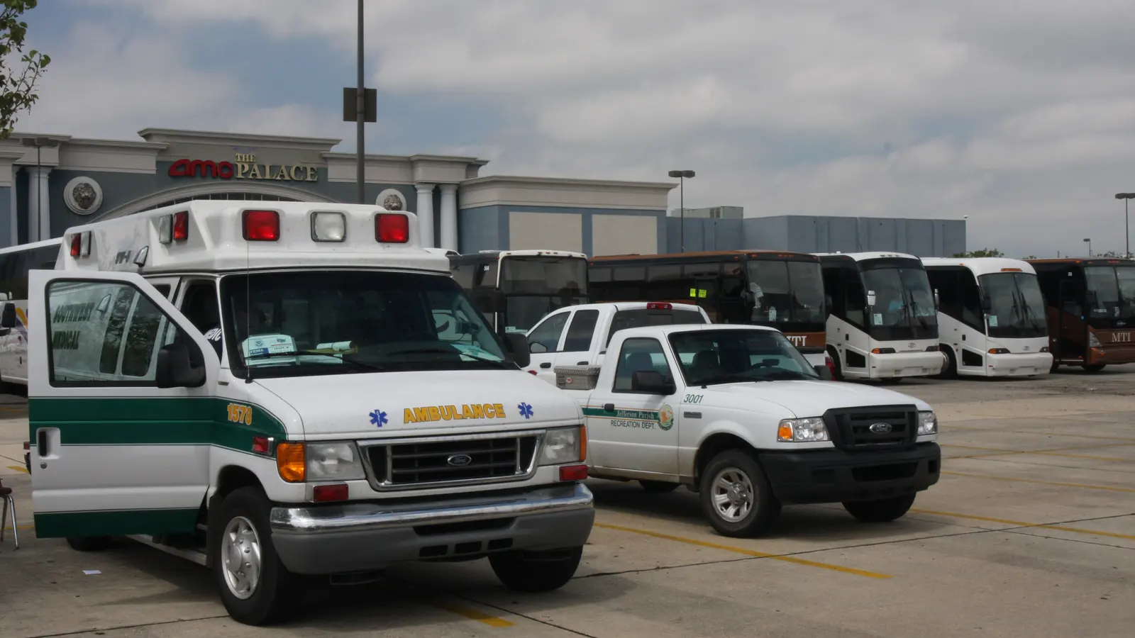 An American ambulance parked alongside emergency vehicles at a staging depot