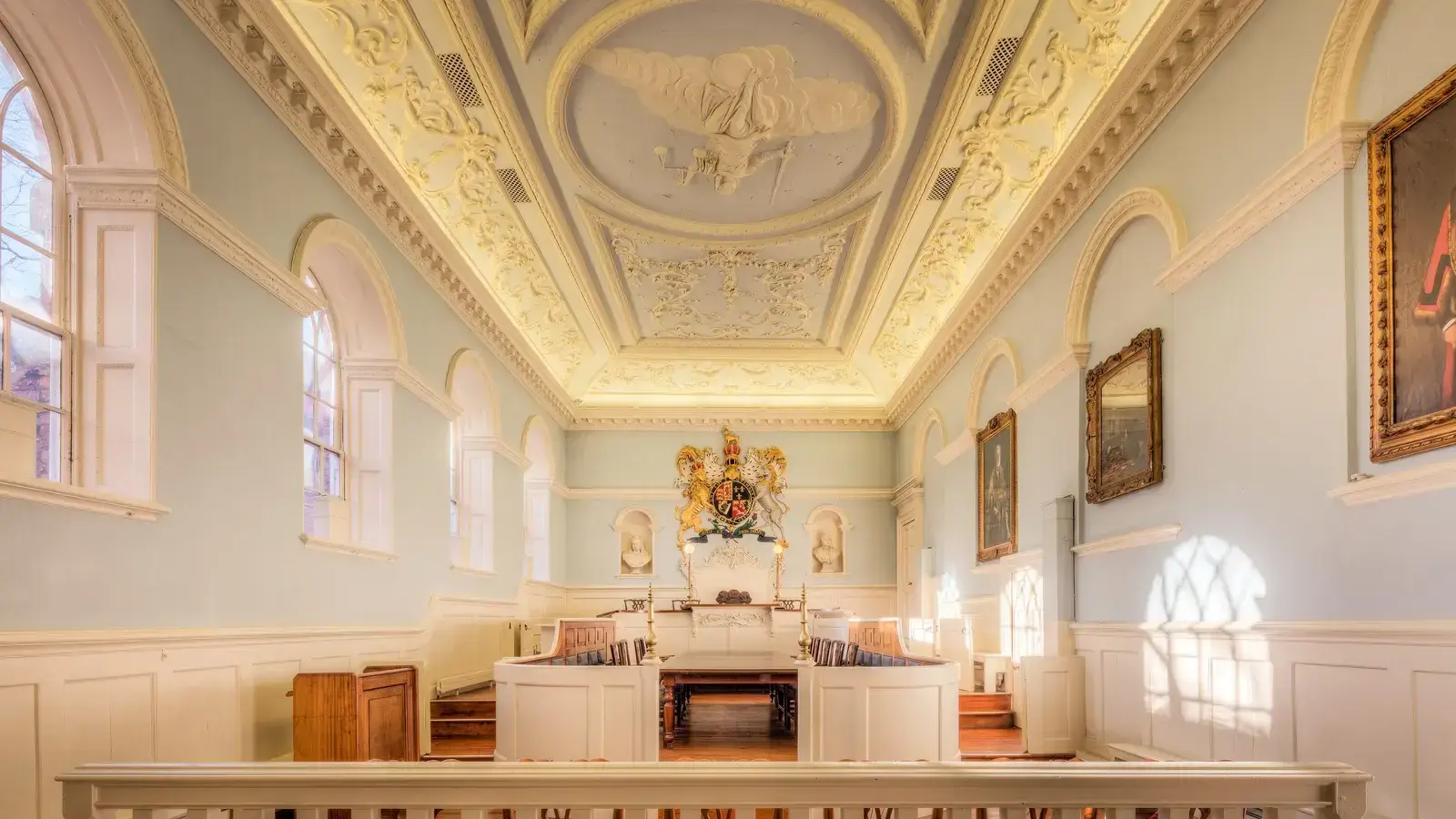 The panelled interior of the historic courtroom at Beverley Guildhall, with the bench beneath a decorated ceiling