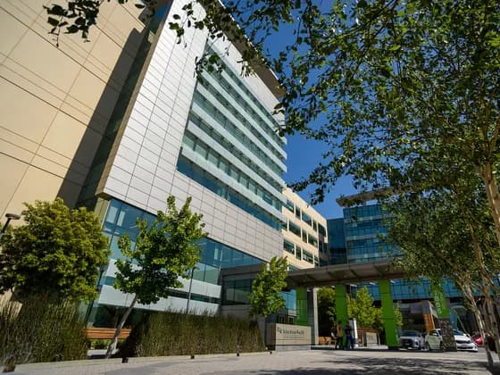 The facade of the UCSF Mission Bay campus. This building houses numerous divisions, including the Bakar Cancer Hospital, Betty Irene Moore Women's Hospital, and Benioff Children's Hospital UCSF School of Dentistry (DDS) — The facade of the UCSF Mission Bay campus. This building houses numerous divisions
