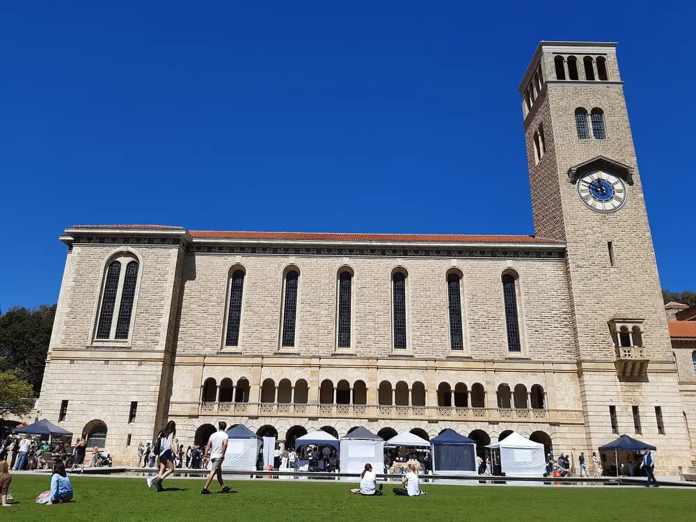 Winthrop Hall clock tower and sandstone facade, the iconic flagship building of the University of Western Australia at its Crawley (Perth) campus, host of the UWA Dental School.