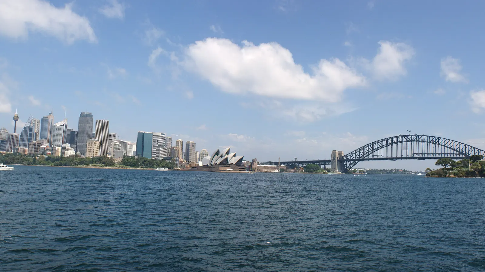 The Sydney skyline across the harbour, with the Opera House and Harbour Bridge